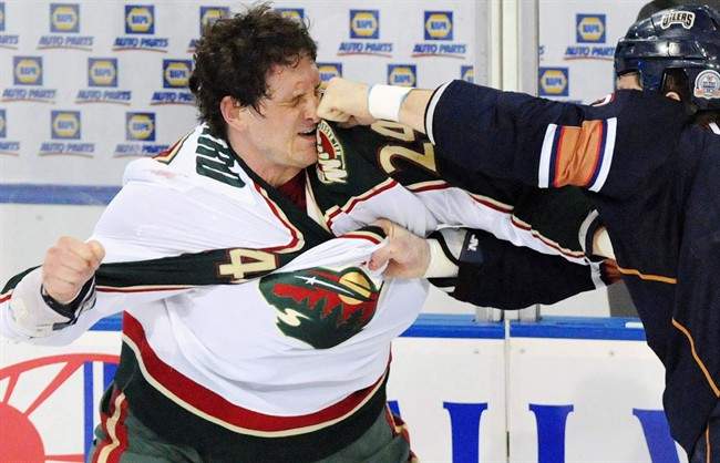 A former minor league hockey player was arrested Tuesday on charges he sold illegally obtained prescription painkillers to former hockey player Derek Boogaard.
