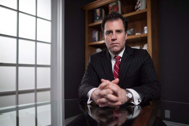 Lawyer Phillip Millar poses for a portrait in his office in London, Ont., Wednesday, April 10, 2013. Millar is representing several women in a class action lawsuit who were allegedly assaulted by a Canadian Forces medical technician. James Wilks, a petty officer second class who is now retired, is charged with 11 counts of sexual assault and 18 counts of breach of trust under the National Defence Act.