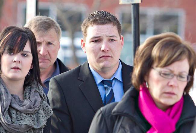Brenden Holubowich makes his way to the courthouse for sentencing in the deaths of four high school football players, in Grande Prairie Alberta, on Tuesday February 26, 2013.