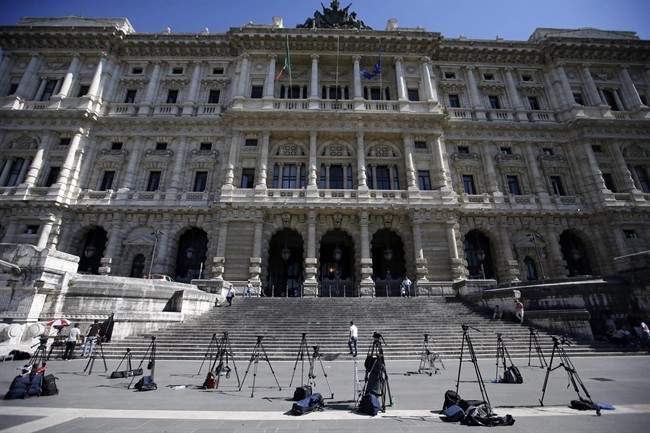 TV camera tripods stand outside the Court of Cassation building where Berlusconi's case on tax fraud will be decided, in Rome, Thursday, July 31, 2013.
