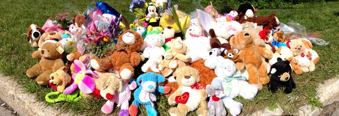 The memorial outside the Gibson family home in Westwood on Friday.