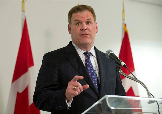 Foreign Affairs Minister John Baird speaks to reporters in Montreal, Wednesday, August 28, 2013.