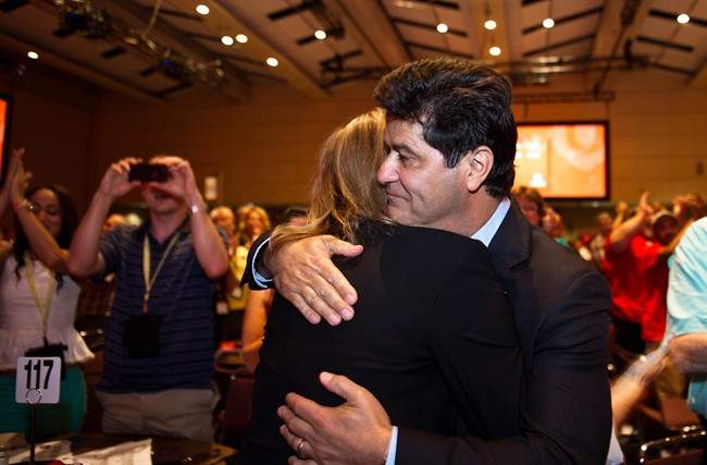 Jerry Dias hugs his wife Leslie after being declared the first president of Unifor at the Unifor founding convention in Toronto, Saturday, August 31, 2013. 