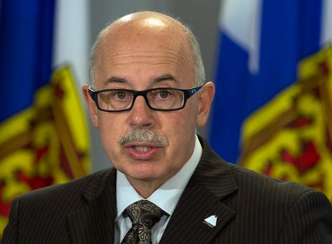 Nova Scotia Attorney General Ross Landry fields questions at a news conference in Halifax on Monday, Aug. 12, 2013.