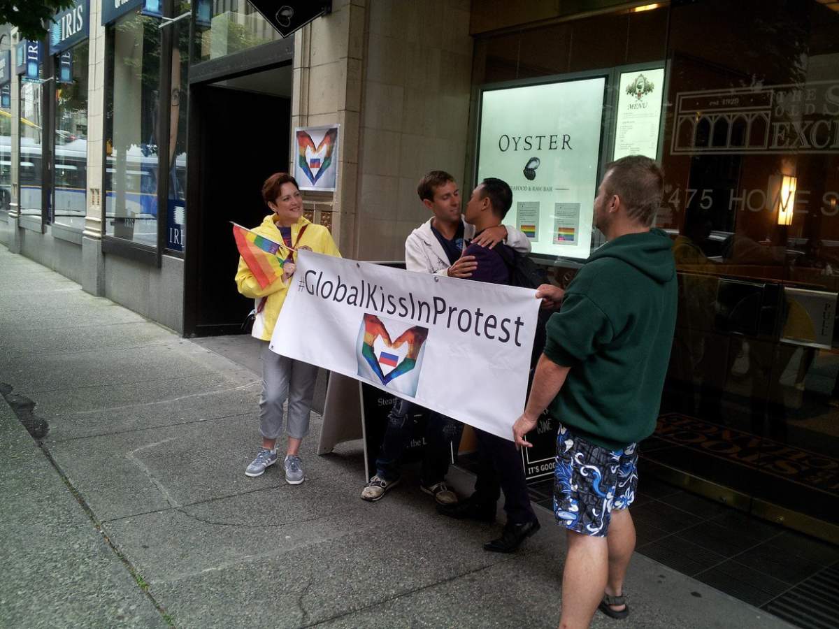 Gay rights supporters stage a kiss-in in front of Russian Consulate in Vancouver - image