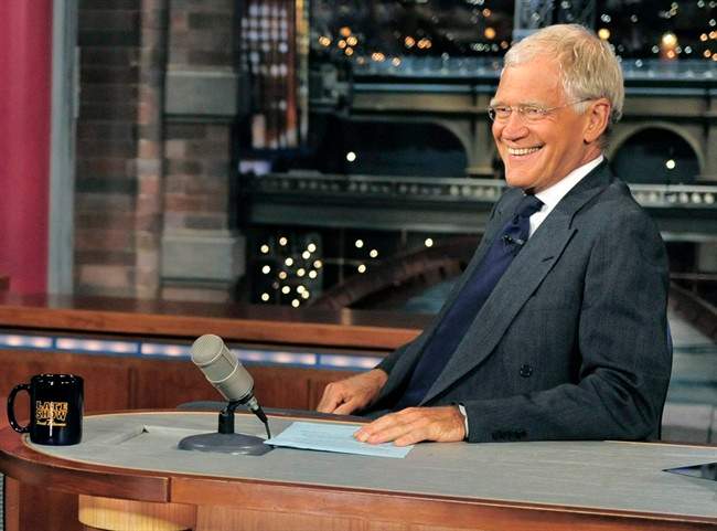 In this July 16, 2013 file photo, host David Letterman smiles on the set of the “Late Show with David Letterman.”