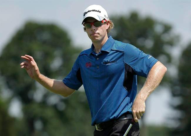 David Hearn, of Canada, reacts after making a birdie putt on the 16th hole during the first round of the PGA Championship golf tournament at Oak Hill Country Club, Thursday, Aug. 8, 2013, in Pittsford, N.Y. 