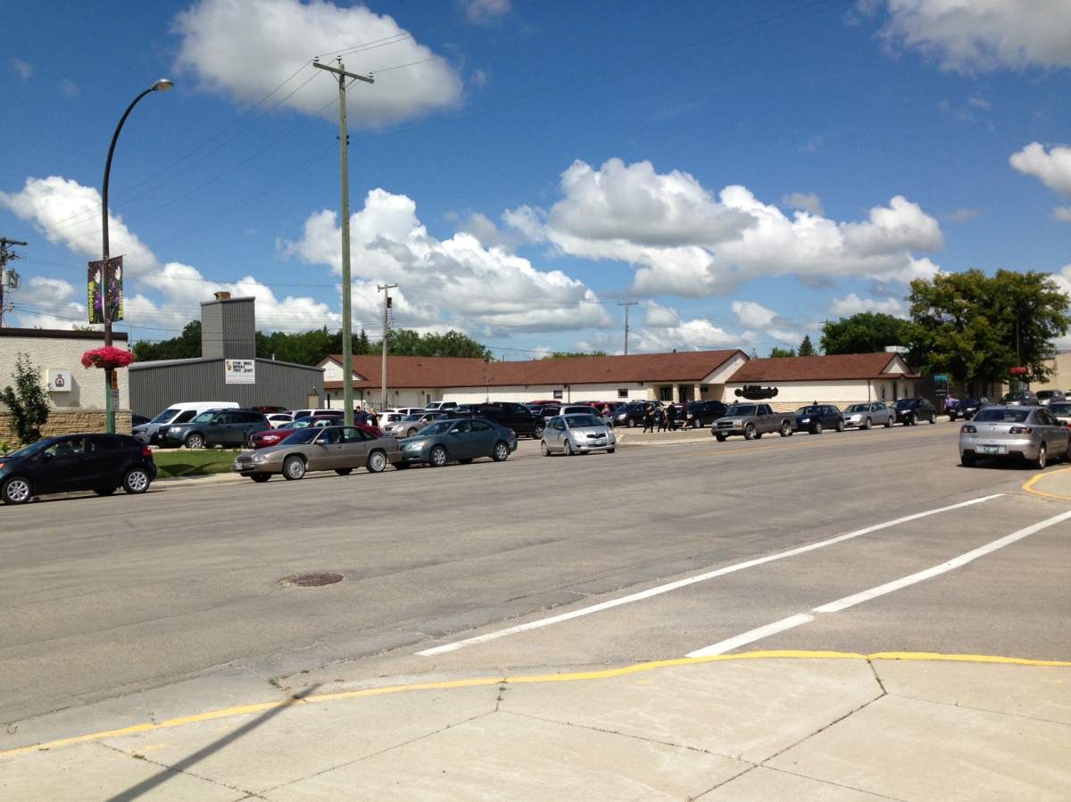 Cars pack the street and parking lot at the funeral home in Stonewall for the Gibson family memorial service on Thursday.
