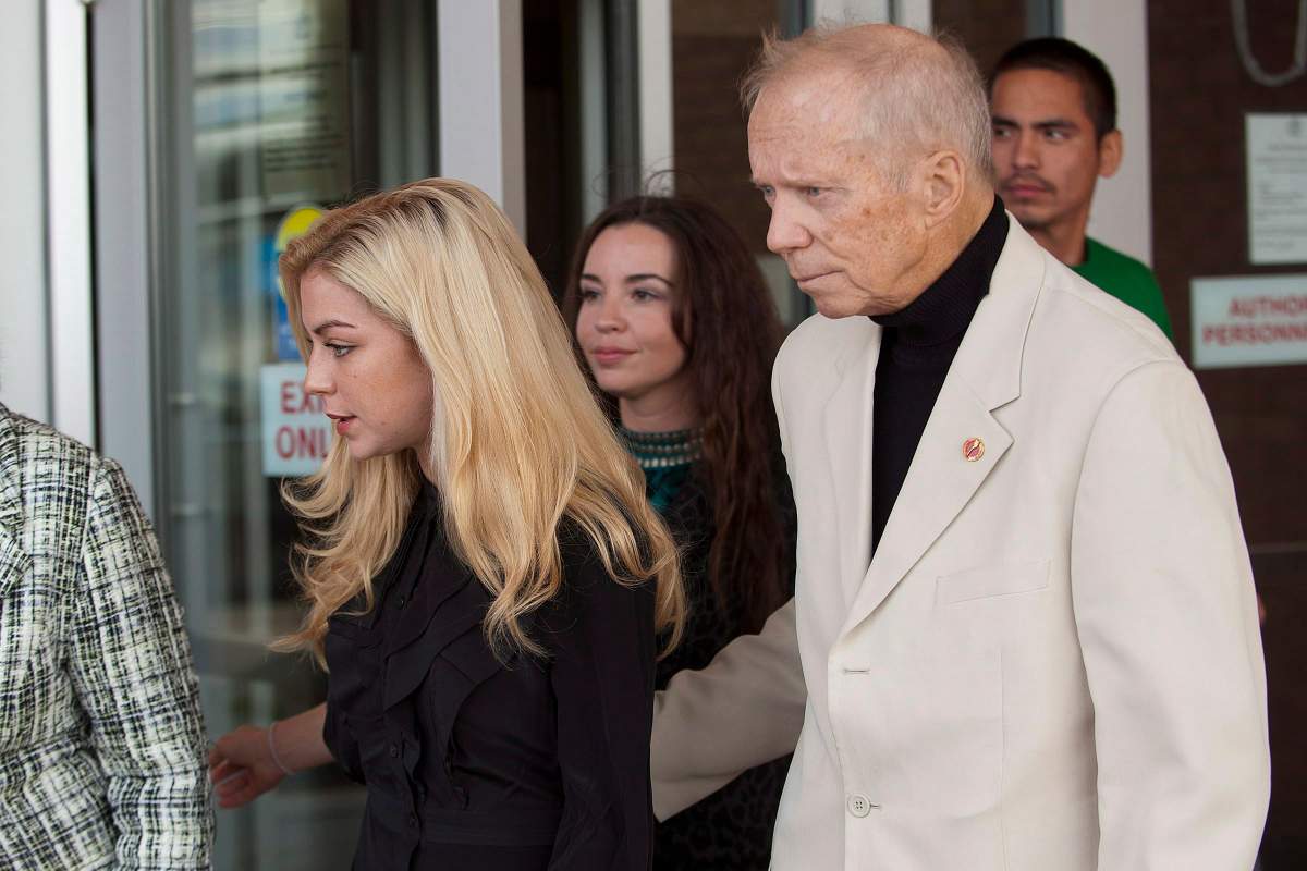 Manitoba Senator Rod Zimmer and his wife Maygan Sensenberger leave provincial court in Saskatoon, Thursday, September 20, 2012. THE CANADIAN PRESS/Liam Richards.