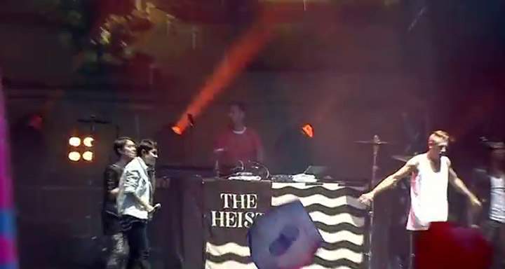 Tegan and Sara, left, on stage with Macklemore & Lewis at Osheaga.
