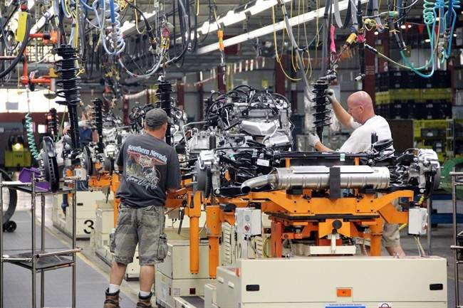 In this Aug. 1, 2013 photo provided by General Motors, cars are assembled at the General Motors Spring Hill Manufacturing Plant in Spring Hill, Tenn. 