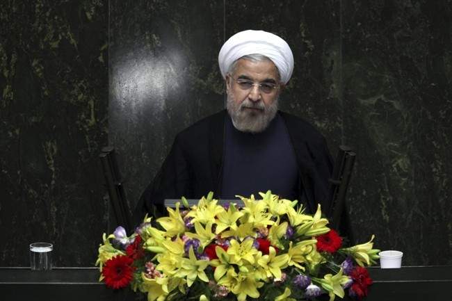 FILE - In this Aug. 15, 2013, file photo, Iranian President Hasan Rouhani speaks during the debate on the proposed Cabinet at the parliament, in Tehran, Iran.The U.N. has slotted the new moderate-leaning president to address the global gathering of leaders on Sept. 24 - just hours after U.S. President Barack Obama is scheduled to wrap up his speech. 