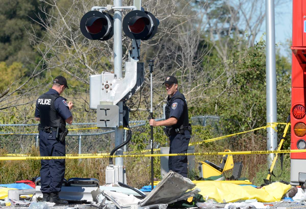 Emergency workers attend to Wednesday's crash scene in Barrhaven, a southwestern suburb of Ottawa. 