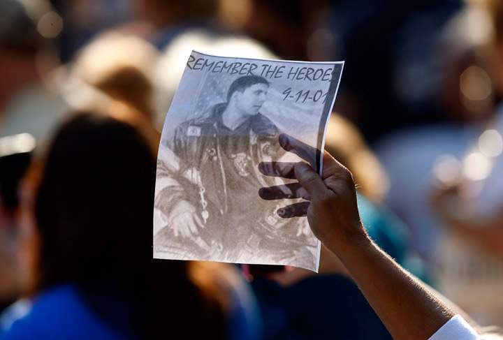 Friends and relatives of the victims of the 9/11 terrorist attacks gather at the National September 11 Memorial at the World Trade Center site, Wednesday, Sept. 11, 2013, for a ceremony marking the 12th anniversary of the attacks in New York. (Photo credit: AP Photo)
