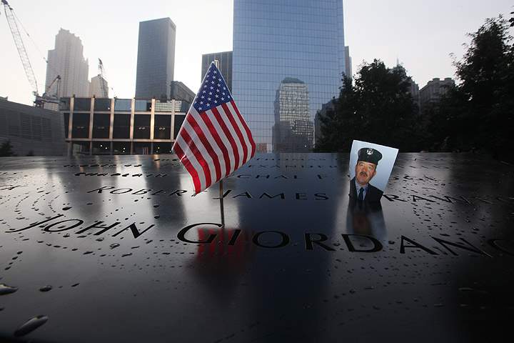 A photo of New York City Firefighter Robert James Crawford who died of the attacks of September 11, 2001 was put there by his family as they came to participate in ceremonies for the twelfth anniversary of the terrorist attacks on lower Manhattan at the World Trade Center site on September 11, 2013 in New York City. (Photo credit: Getty Images)