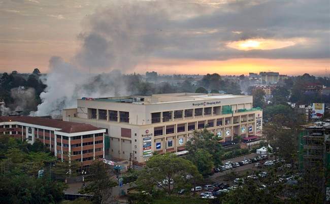 Dawn breaks over the still-smoldering Westgate Mall in Nairobi, Kenya, Thursday, Sept. 26, 2013.