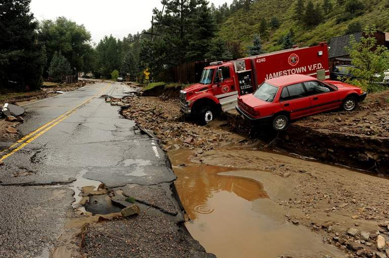 An engine from Jamestown Fire Department and another car, are casualties to the flood in Jamestown, CO on September 15, 2013. The town has been completely destroyed from the recent floods. (Helen H. Richardson/ The Denver Post)