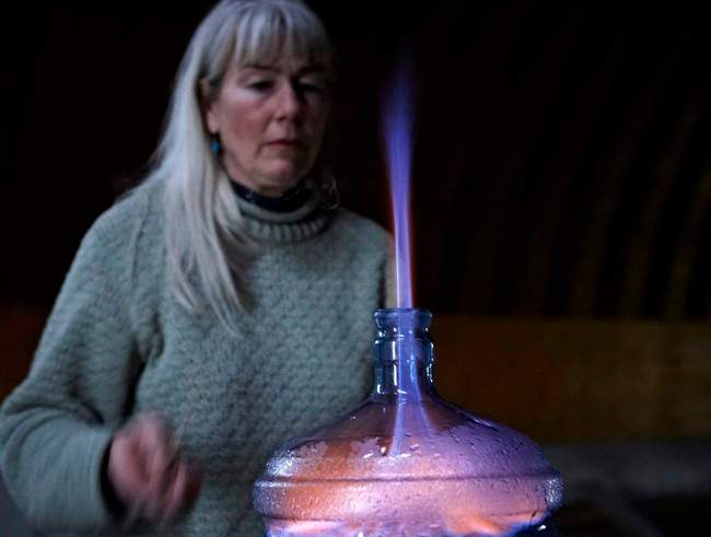 Oil patch consultant Jessica Ernst burns off some of the methane that is in her well water in Rosebud, Alta., June 2, 2011.
