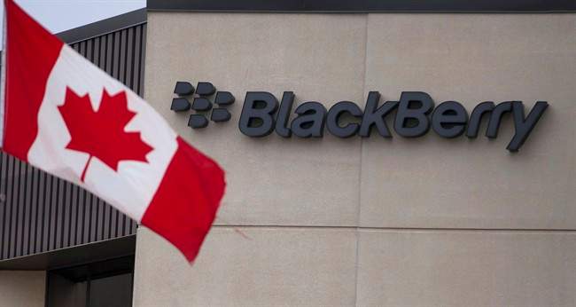 A Canadian flag flies at BlackBerry's headquarters in Waterloo, Ont., Tuesday, July 9, 2013. Fairfax Financial Holdings has offered to buy BlackBerry Ltd. Toronto-based Fairfax is offering US$9 cash for each share it doesn't already own, in a deal that values BlacKBerry at about US$4.7 billion.