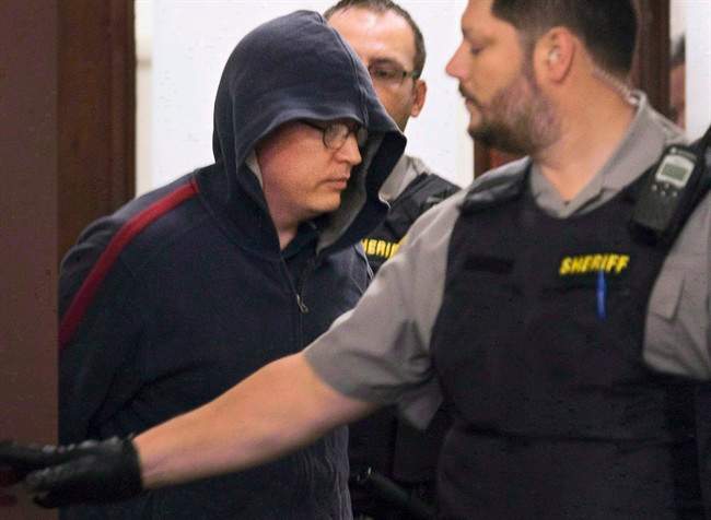 Jeffrey Paul Delisle leaves court in Halifax on Oct. 10, 2012.