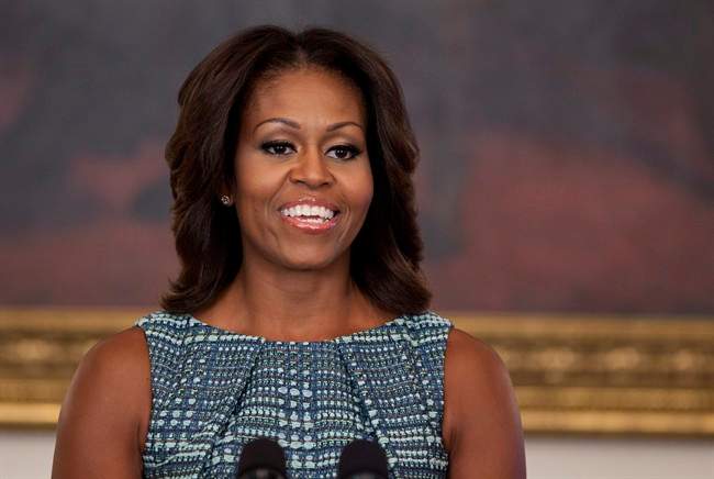 First lady Michelle Obama pausess during an event about food marketing to children in the State Dining Room of the White House on Wednesday, Sept. 18, 2013, in Washington.