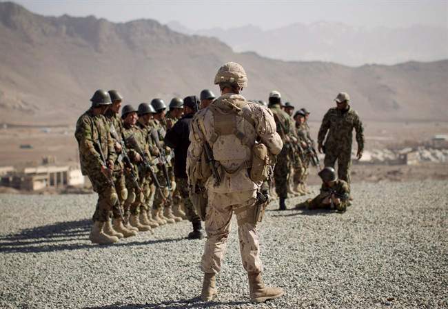 A Canadian soldier mentors a training session of Afghan National Army soldiers in 2012 at the Kabul Military Training Center in Afghanistan.