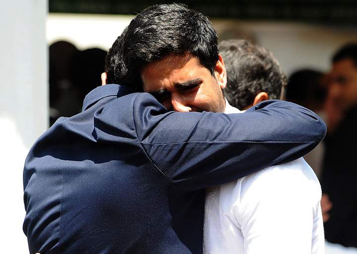 Griving relatives console each other on September 26, 2013 during the funeral ceremony for Kenyan journalist Ruhila Adatia-Sood in Nairobi. 