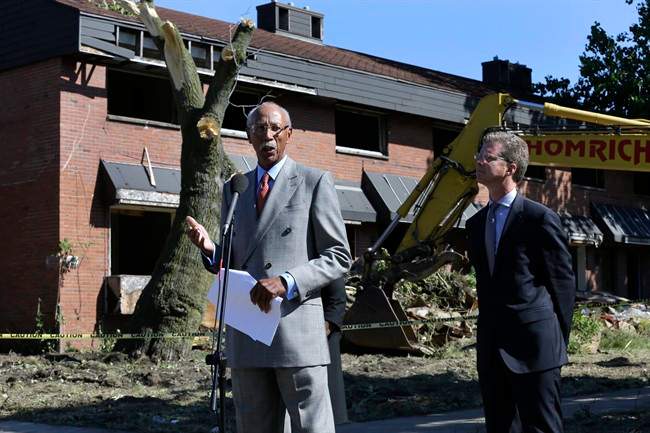 Detroit Mayor Dave Bing, left, speaks while United States Department of Housing and Urban Development Secretary Shaun Donovan listens at the first stage of demolishing the Frederick Douglass Homes in Detroit, Wednesday, Sept. 4, 2013. The graffiti-covered complex comprising several city blocks is better known as the Brewster projects. A $6.5 million emergency federal grant covers the initial phase of demolition and cleanup, and officials say the city will be eligible for more money when that’s completed. The federal money comes at a crucial time for the city, which is overseen by a state-appointed emergency manager and in July became the nation’s largest city to file for bankruptcy. 