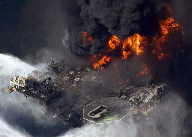 In an April 21, 2010 file photo, the Deepwater Horizon oil rig burns after a deadly explosion in the Gulf of Mexico.