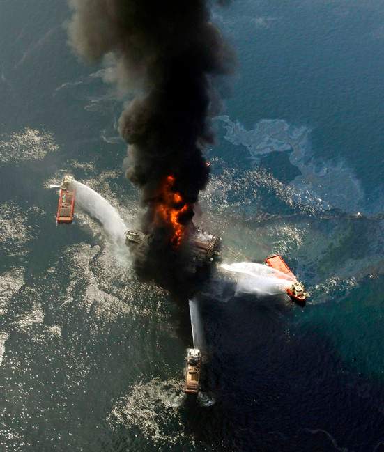 In an April 21, 2010 file photo, the Deepwater Horizon oil rig burns after a deadly explosion in the Gulf of Mexico. 