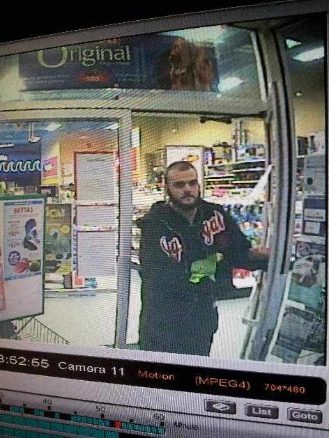 A picture was posted online by the store showing the alleged thief with the parrot that is believed to be stolen in his hand.