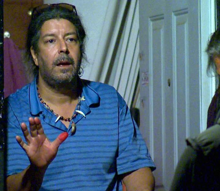 Andreas Pirelli speaks to police from his Parkdale apartment.