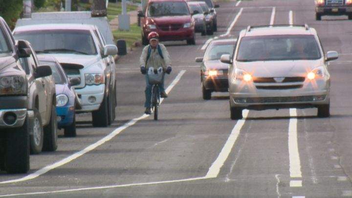 Gerry Gibeault rides his bike along 106th Street September 18, 2013.