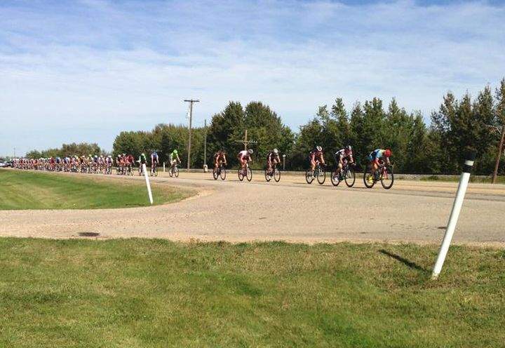 Cyclists participating in the Tour of Alberta make their way through the province, south of Millet.