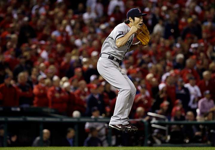 Boston Red Sox relief pitcher Koji Uehara reacts after getting St. Louis Cardinals' Matt Holliday to fly out and end Game 5 of baseball's World Series Monday, Oct. 28, 2013, in St. Louis. The Red Sox won 3-1 to take a 3-2 lead in the series.