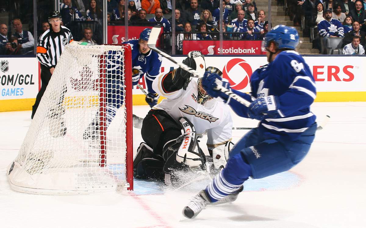 Phil Kessel #81 of the Toronto Maple Leafs scores his third goal on Jonas Hiller #1 of the Anaheim Ducks during NHL action at the Air Canada Centre October 22, 2013 in Toronto.