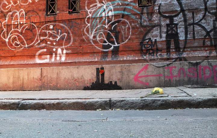 Banksy’s latest work depicting the New York City skyline with the former World Trade Center Twin Towers is shown October 15, 2013 in the Tribeca neighborhood of New York City.