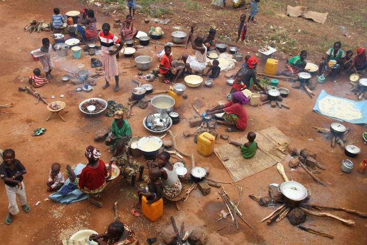 In this Sunday, Sept. 15, 2013 photo, civilians fleeing violent attacks by armed rebels seek refuge in the yard of a church in Bossangoa, Central African Republic.