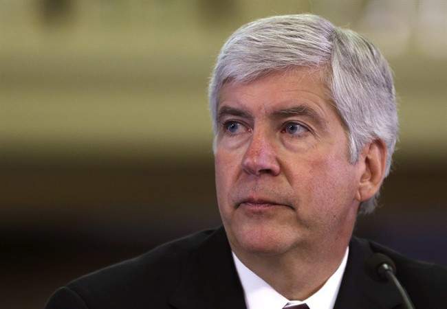 FILE - In this Feb. 7, 2013 file photo, Michigan Gov. Rick Snyder presents his third state budget before the state Legislature in Lansing, Mich. Snyder is taking questions under oath as labor unions and other creditors in Detroit’s bankruptcy try to understand why he signed off on the largest public filing in U.S. history. 