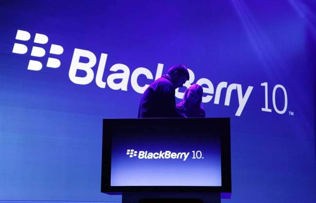 Stagehands prepare for the introduction of the BlackBerry 10, Wednesday, Jan. 30, 2013 in New York. BlackBerry and some key executives are facing allegations they misled investors on the state of the company???s future, and how its BlackBerry 10 would fare against competitors. 
