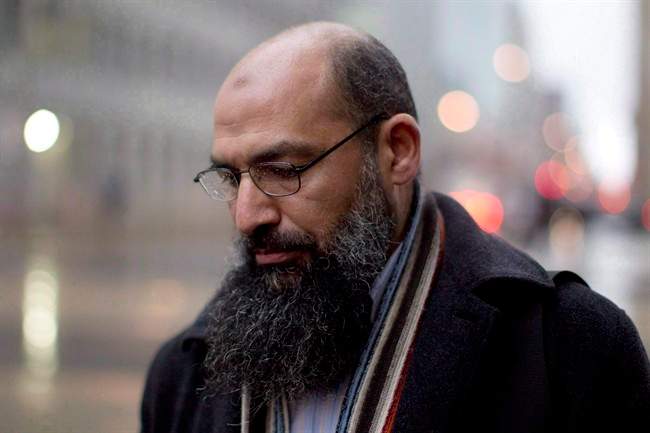 Mohamed Mahjoub stands outside a federal court in Toronto on December 15, 2011. 