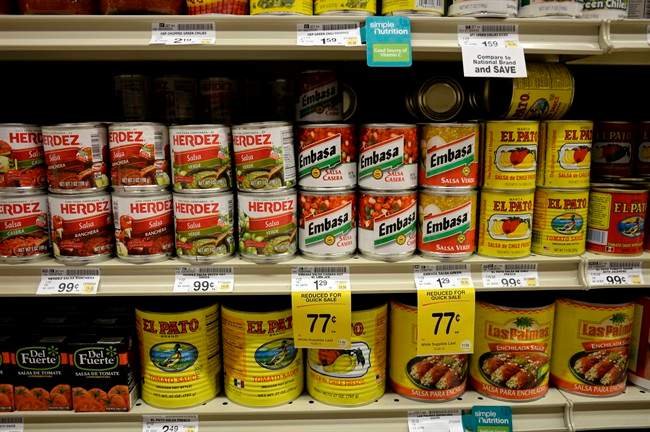 Salsas and other items are seen in the International food aisle of a grocery store.