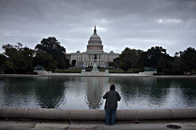 Cloudy skies shroud the Capitol in Washington, Monday morning, Oct. 14, 2013.