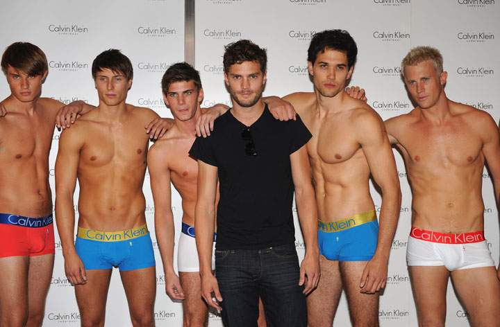 Jamie Dornan poses with Calvin Klein underwear models in 2009.