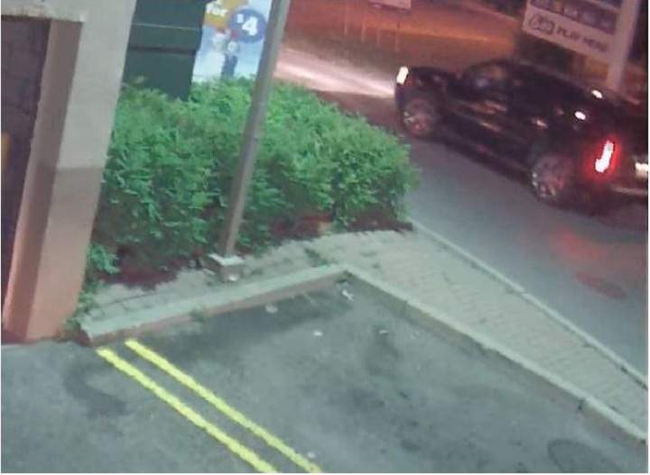 Police surveillance of Ford and Lisi with packages at a Scarlett Road gas station - image