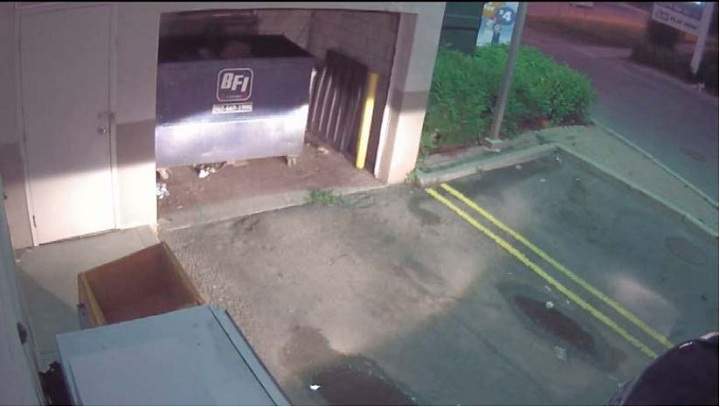Police surveillance of Ford and Lisi with packages at a Scarlett Road gas station - image