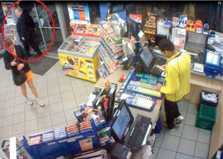 Police surveillance of Ford and Lisi with packages at a Scarlett Road gas station - image