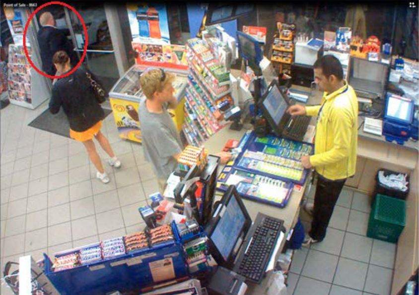 Police surveillance of Ford and Lisi with packages at a Scarlett Road gas station - image