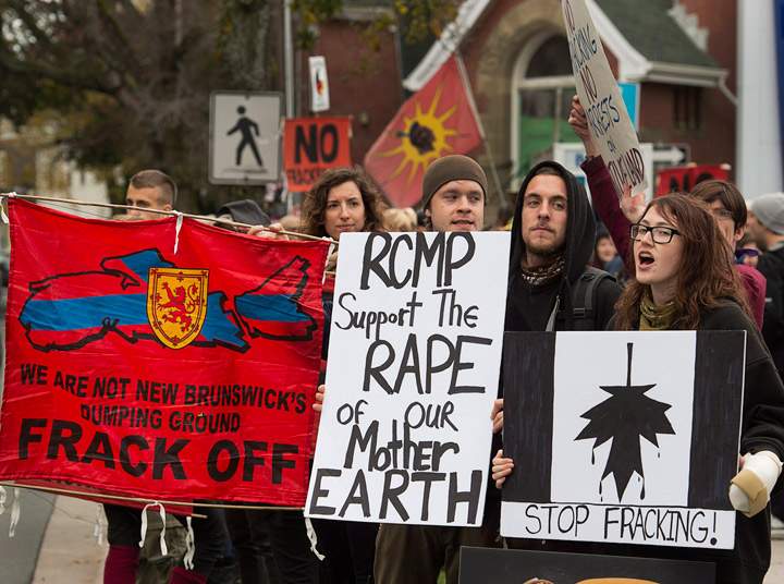 Demonstrators rally against shale gas exploration in Halifax on Friday, Oct.18, 2013. The effort was in support of protesters, some of whom included members of the Elsipogtog First Nation, who rallied against SWN Resources and its possible plans to proceed with shale gas development in eastern New Brunswick. (Photo credit: The Canadian Press)