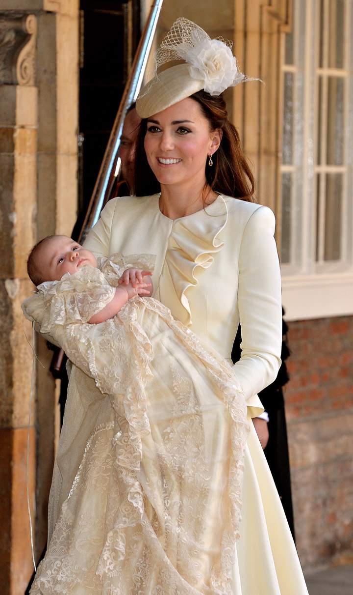 Catherine, Duchess of Cambridge carries her son Prince George Of Cambridge after his christening at the Chapel Royal in St James’s Palace on October 23, 2013 in London, England. (Photo credit: Getty Images)